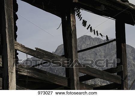 A wooden veranda in front of a mountain range View Large Photo Image Stock Photo - A wooden veranda in front of a mountain range. Fotosearch