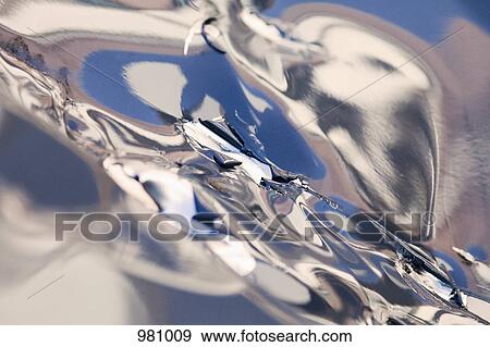 Abstract reflections on a silver surface View Large Photo Image Stock Photo - Abstract reflections on a silver surface. Fotosearch