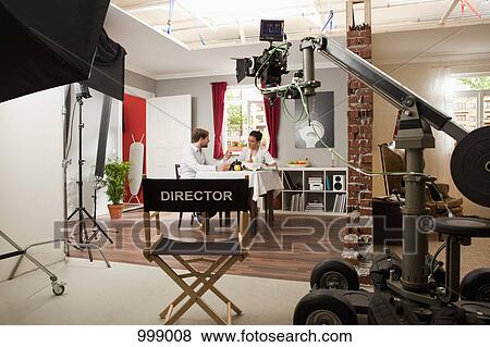 Actors performing a scene on a film set View Large Photo Image Stock Photo - Actors performing a scene on a film set. Fotosearch