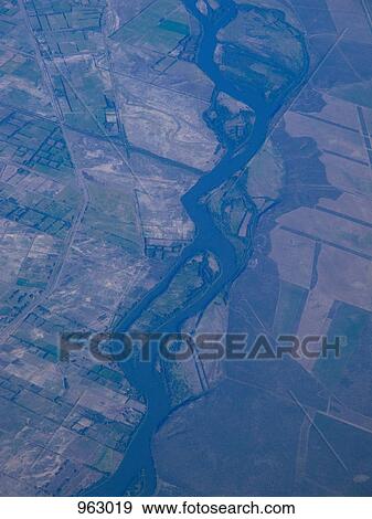 Aerial view of cultivated land View Large Photo Image Stock Photo - Aerial view of cultivated land. Fotosearch