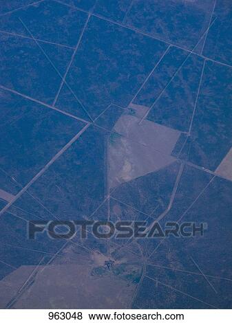 Aerial view of cultivated land View Large Photo Image Stock Photo - Aerial view of cultivated land. Fotosearch