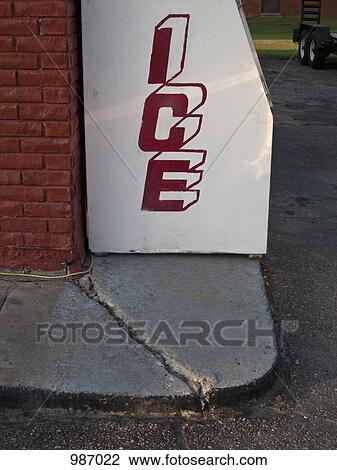 Stock Image - An ice maker outside of a building. Fotosearch