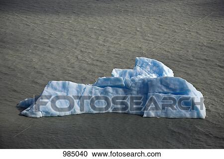 An iceberg floating on water, Torres del Paine National Park, Chile View Large Photo Image Stock Image - An iceberg floating on water, Torres del Paine National Park, Chile. Fotosearch