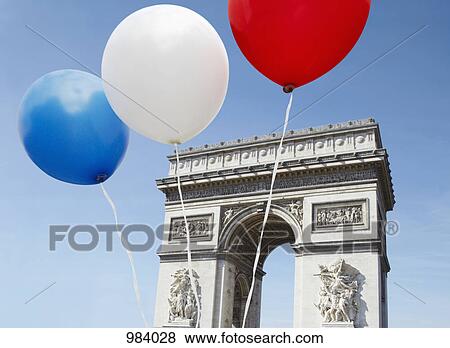 Balloons in the colors of the French flag in front of the Arc De Triomphe View Large Photo Image Stock Photo - Balloons in the colors of the French flag in front of the Arc De Triomphe. Fotosearch