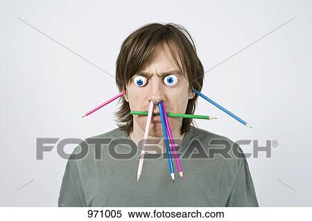 Stock Photography - Bizarre man with pencils . Fotosearch