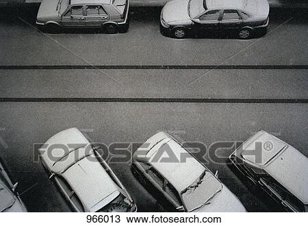 Cars covered in snow on a street View Large Photo Image Stock Image - Cars covered in snow on a street. Fotosearch
