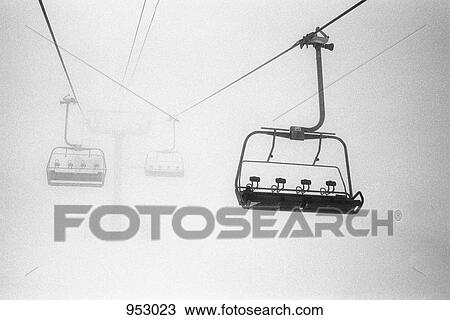 Chairlift in the fog View Large Photo Image Stock Image - Chairlift in the fog. Fotosearch