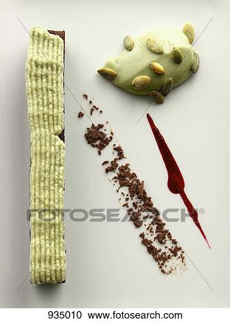 Chocolate cake with pistachio foam and pistachio custard dessert View Large Photo Image Stock Image - Chocolate cake with pistachio foam and pistachio custard dessert. Fotosearch