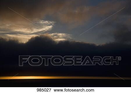 Clouds and sky above the sea at dusk View Large Photo Image Stock Photo - Clouds and sky above the sea at dusk. Fotosearch