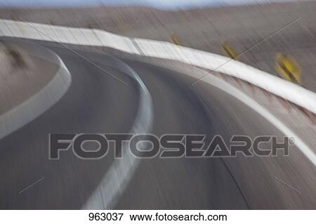 Curve in a road, blurred motion View Large Photo Image Stock Photo - Curve in a road, blurred motion. Fotosearch