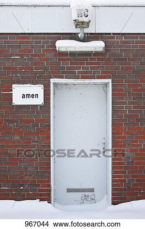 Picture - DAMEN the Swedish word for WOMEN missing a D outside of a public toilet. Fotosearch