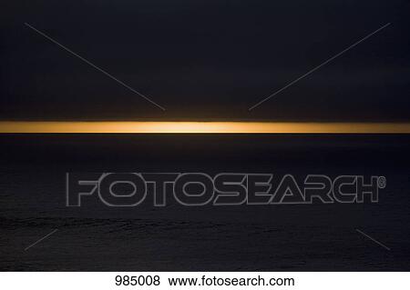 Dark clouds above the sea at dusk View Large Photo Image Stock Photo - Dark clouds above the sea at dusk. Fotosearch