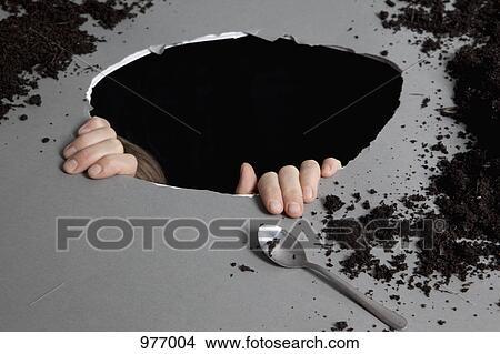 Detail of a person in a hole View Large Photo Image Picture - Detail of a person in a hole. Fotosearch