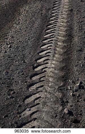 Detail of a tire track on a dirt road View Large Photo Image Stock Photography - Detail of a tire track on a dirt road. Fotosearch