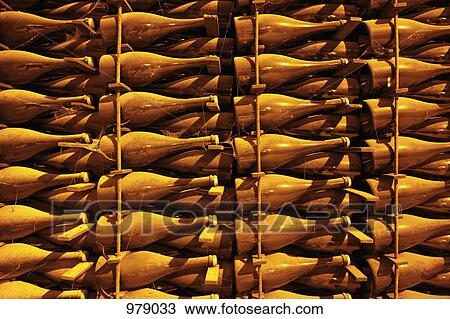 Detail of bottles of champagne in a rack View Large Photo Image Stock Image - Detail of bottles of champagne in a rack. Fotosearch
