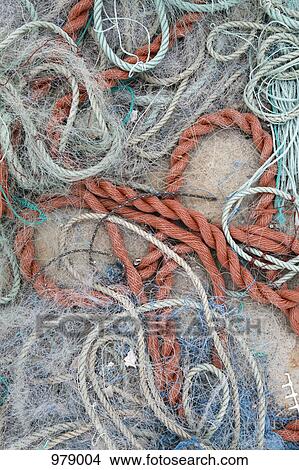 Detail of ropes and fishing nets on the ground View Large Photo Image Picture - Detail of ropes and fishing nets on the ground. Fotosearch