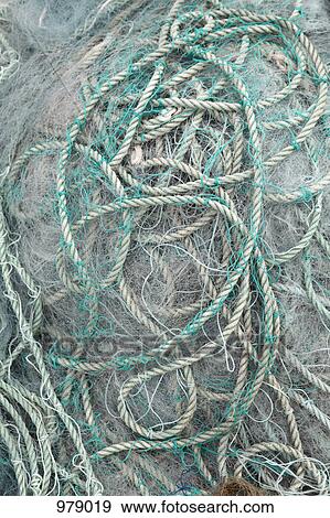 Detail of ropes and fishing nets on the ground View Large Photo Image Stock Photo - Detail of ropes and fishing nets on the ground. Fotosearch