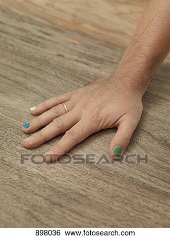 Detail of the hand of a man with painted nails View Large Photo Image Stock Photograph - Detail of the hand of a man with painted nails. Fotosearch