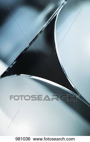 Stock Photograph - Detail of three metal discs. Fotosearch
