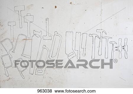 Drawn outlines of hand tools on a wall View Large Photo Image Stock Photo - Drawn outlines of hand tools on a wall. Fotosearch