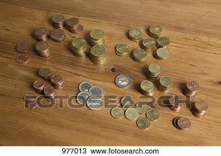 Euro coins on a wooden table View Large Photo Image Stock Image - Euro coins on a wooden table. Fotosearch