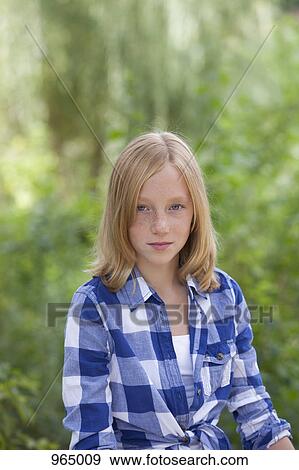 Girl in checked shirt View Large Photo Image Stock Photo - Girl in checked shirt. Fotosearch