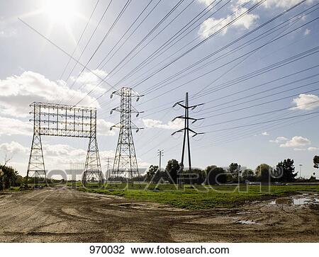 Group of electricity pylons View Large Photo Image Stock Image - Group of electricity pylons. Fotosearch