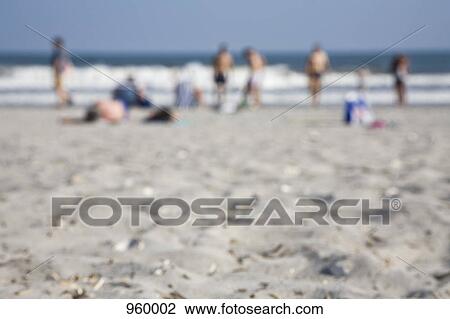 Group of people on a beach View Large Photo Image Stock Image - Group of people on a beach. Fotosearch