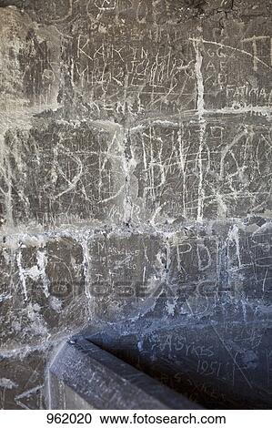 Handwritten graffiti etched into a stone wall View Large Photo Image Stock Image - Handwritten graffiti etched into a stone wall. Fotosearch