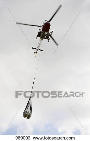 Helicopter carrying bundle View Large Photo Image Stock Image - Helicopter carrying bundle. Fotosearch