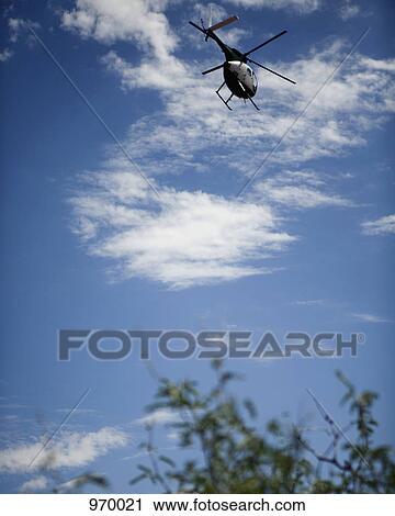 Helicopter flying View Large Photo Image Stock Image - Helicopter flying. Fotosearch