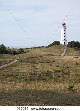 Lighthouse on a hill overlooking land View Large Photo Image Stock Photography - Lighthouse on a hill overlooking land. Fotosearch