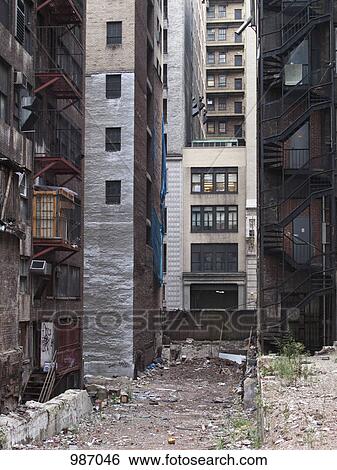Stock Photograph - Litter in a city alley. Fotosearch
