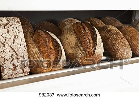 Loaves of bread at a bakery View Large Photo Image Stock Photo - Loaves of bread at a bakery. Fotosearch