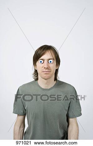 Man with plastic eyes looking at camera View Large Photo Image Stock Image - Man with plastic eyes looking at camera. Fotosearch