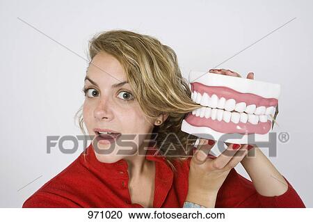 Model teeth biting hair View Large Photo Image Stock Image - Model teeth biting hair . Fotosearch
