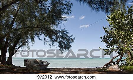 Moored rowboat on the beach View Large Photo Image Stock Image - Moored rowboat on the beach. Fotosearch