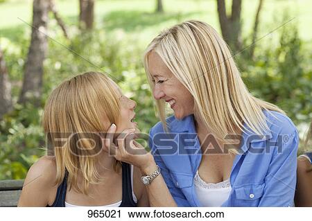 Mother and Daughter facing each other View Large Photo Image Stock Image - Mother and Daughter facing each other. Fotosearch