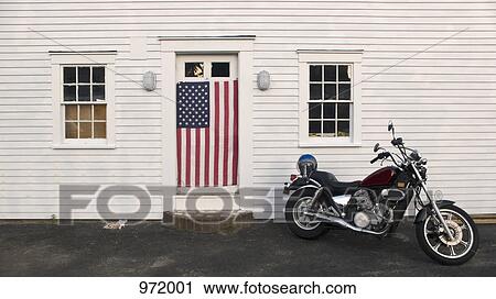 Stock Image - Motorcycle and American flag. Fotosearch