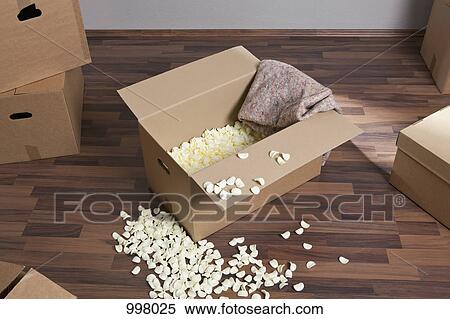 Moving boxes, packing peanuts and a drop cloth View Large Photo Image Stock Photography - Moving boxes, packing peanuts and a drop cloth. Fotosearch