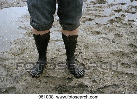 Muddy feet on a wet beach View Large Photo Image Stock Photo - Muddy feet on a wet beach. Fotosearch