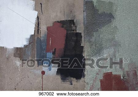 Stock Image - Paint swatches on a wall. Fotosearch