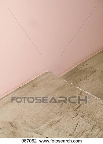 Stock Image - Part of a pink wall and concrete step. Fotosearch