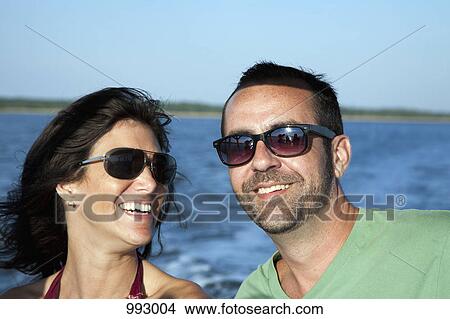 Portrait of a couple enjoying summer, outdoors View Large Photo Image Picture - Portrait of a couple enjoying summer, outdoors. Fotosearch