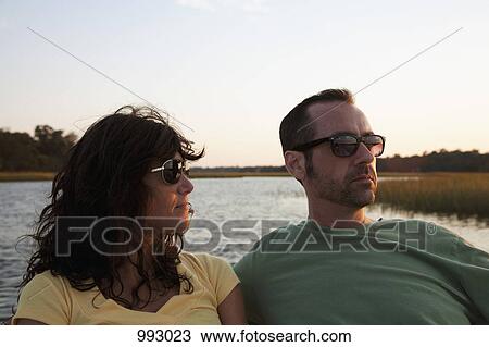 Portrait of a couple enjoying summer, outdoors View Large Photo Image Stock Image - Portrait of a couple enjoying summer, outdoors. Fotosearch