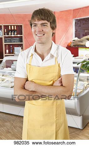 Portrait of a sales clerk in a gourmet delicatessen View Large Photo Image Stock Photography - Portrait of a sales clerk in a gourmet delicatessen. Fotosearch