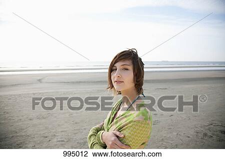 Portrait of a young woman at the beach View Large Photo Image Stock Image - Portrait of a young woman at the beach. Fotosearch