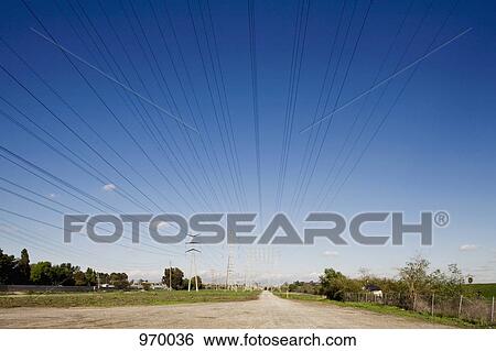 Power lines meeting at vanishing point View Large Photo Image Stock Photograph - Power lines meeting at vanishing point . Fotosearch