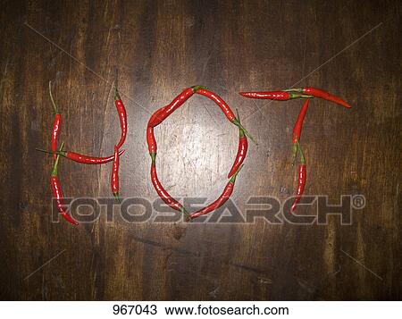 Red chili peppers spelling the word HOT View Large Photo Image Stock Image - Red chili peppers spelling the word HOT. Fotosearch