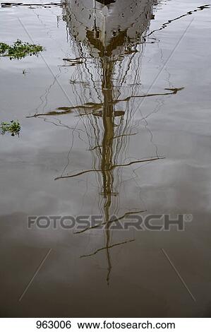 Reflection of a ship on water surface View Large Photo Image Stock Photograph - Reflection of a ship on water surface. Fotosearch